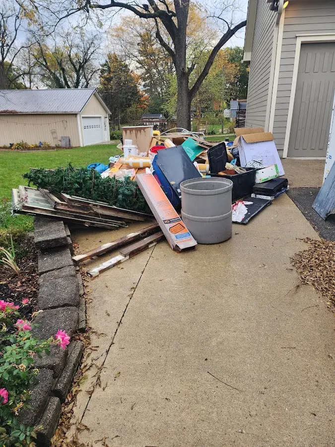 Dumpster being loaded with debris for Residential Dumpster Rental in Perry Hall